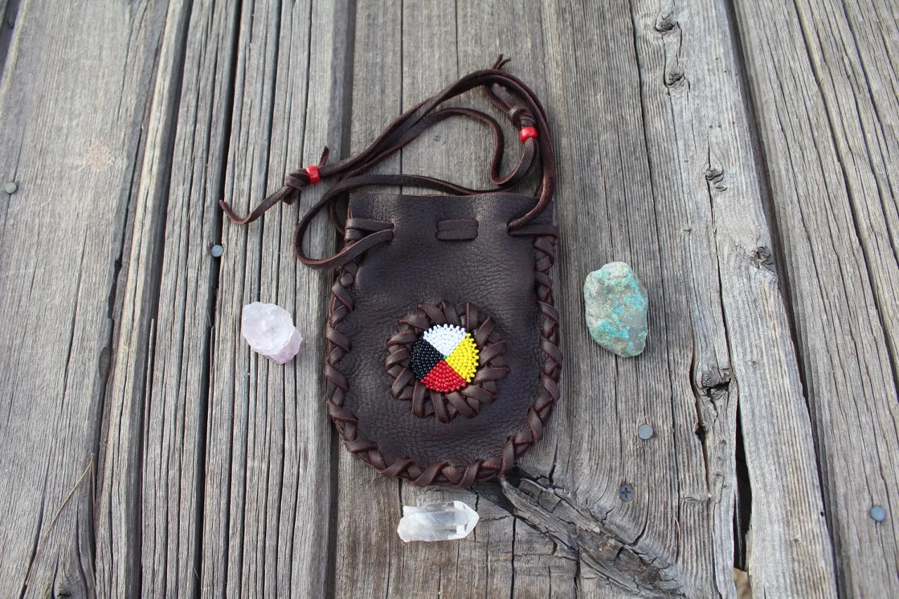 Beaded leather amulet bag with four directions beadwork