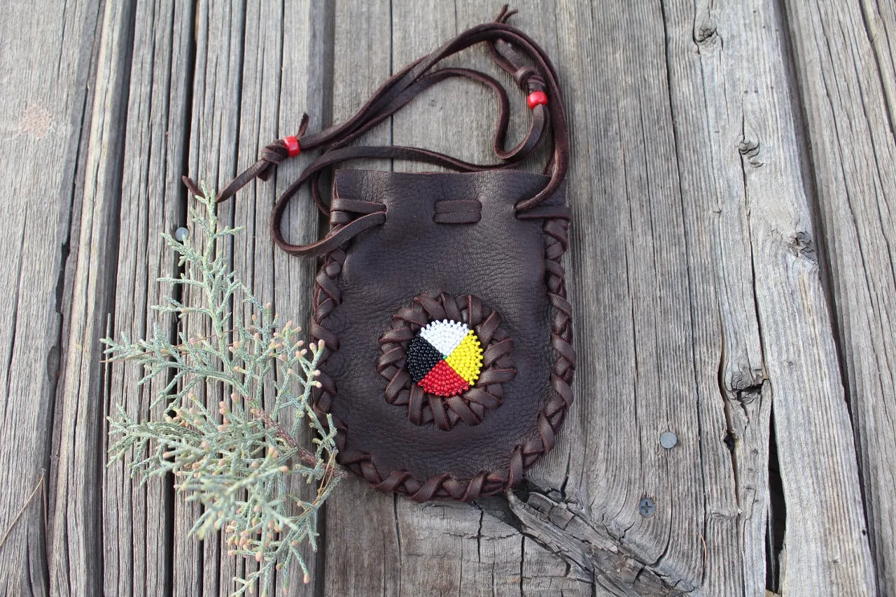 Beaded leather amulet bag with four directions beadwork