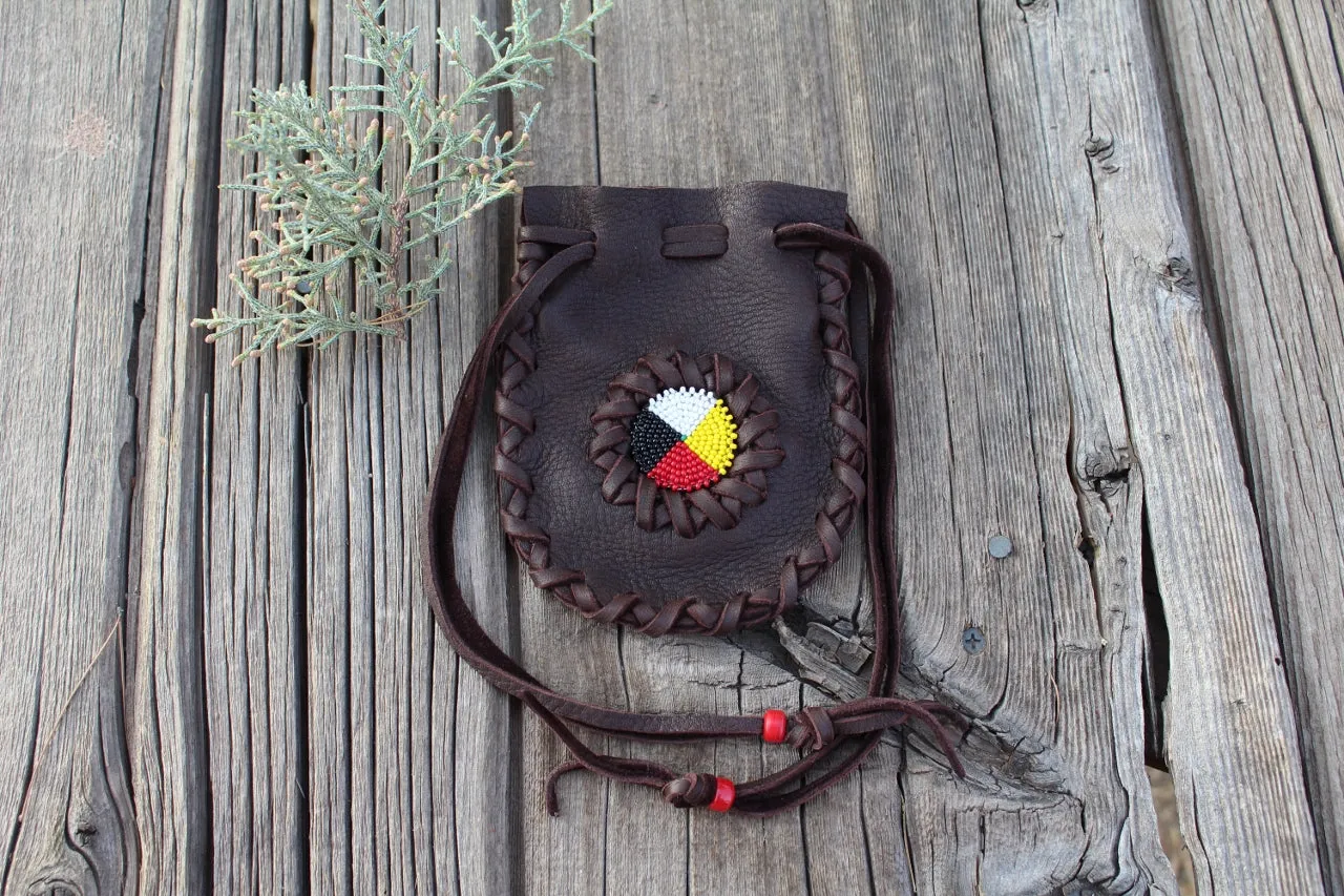 Beaded leather amulet bag with four directions beadwork