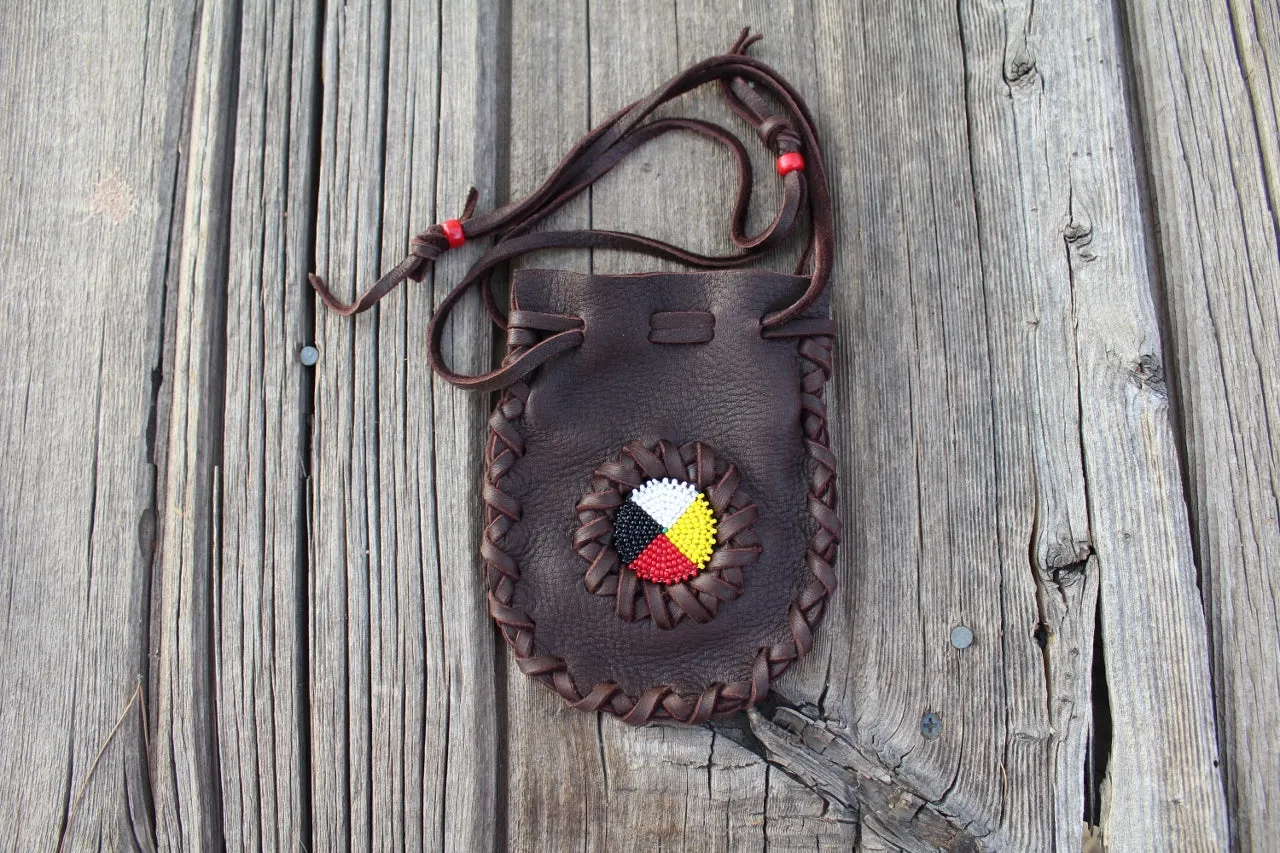 Beaded leather amulet bag with four directions beadwork